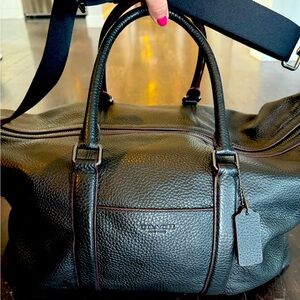 Black leather COACH duffel bag